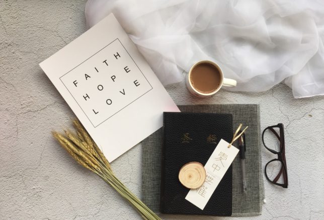 white ceramic mug near black-framed eyeglasses